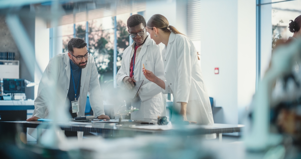 Lab Techs collaborating at modular lab benches