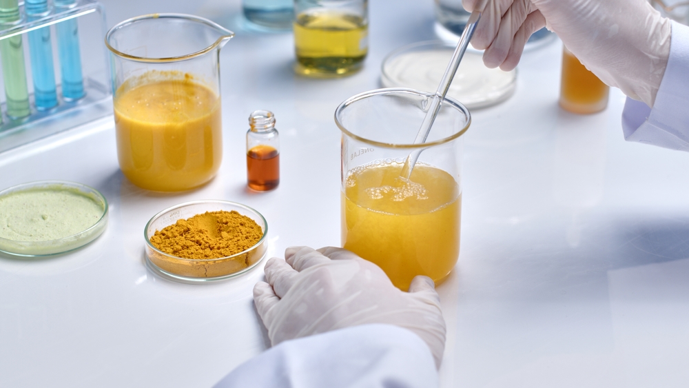 Food scientist working on white work surface 