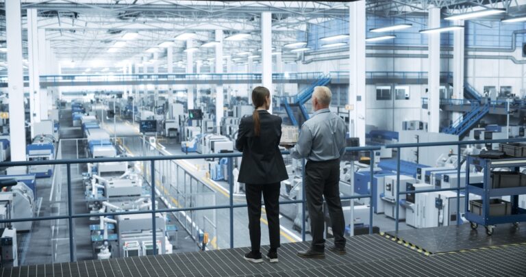 Engineer and Scientist overlooking multi-disciplinary research facility