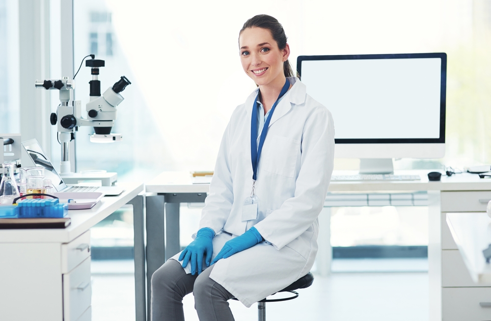 Female scientist seated at her desk 