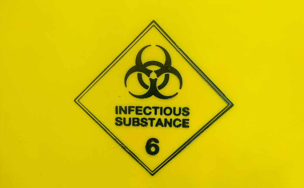 Infectious substance sign on lab bin 