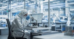 Laboratory seating - Cleanroom Scientist Using a Microscope