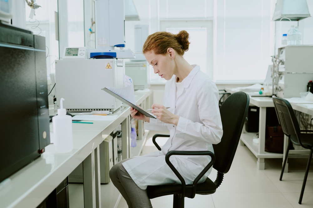 Laboratory seating - scientist analyzing data